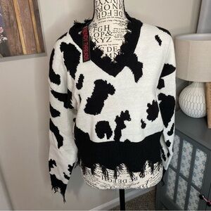 A012 trendy threads Black and White Cow Print Sweater raw hem